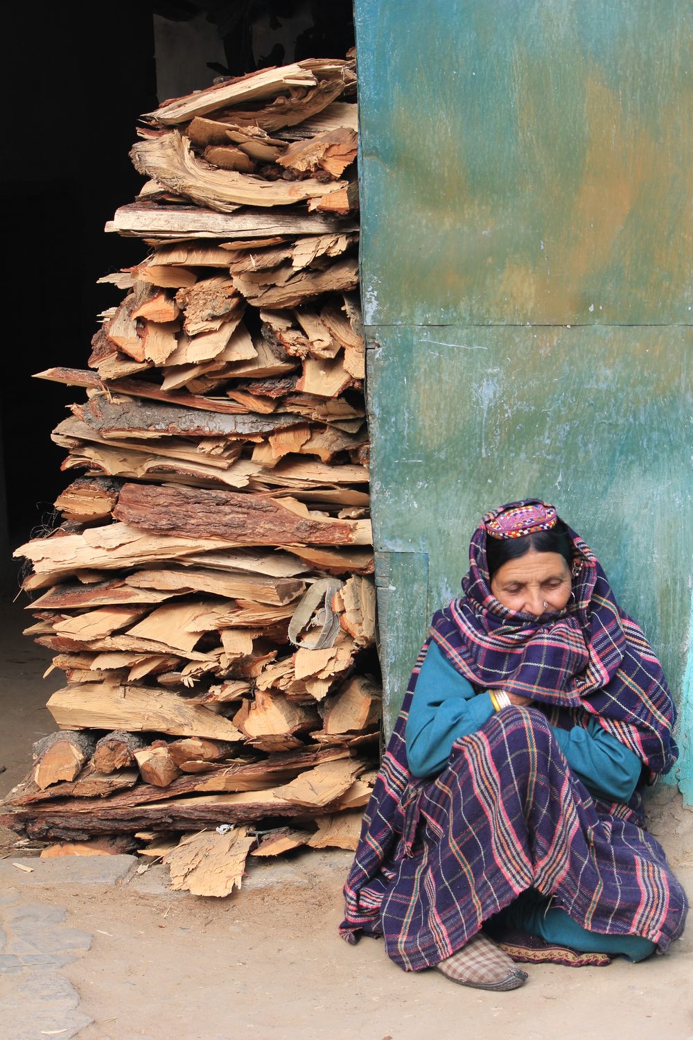 Woman with a stack of firewood, Pangi Valley