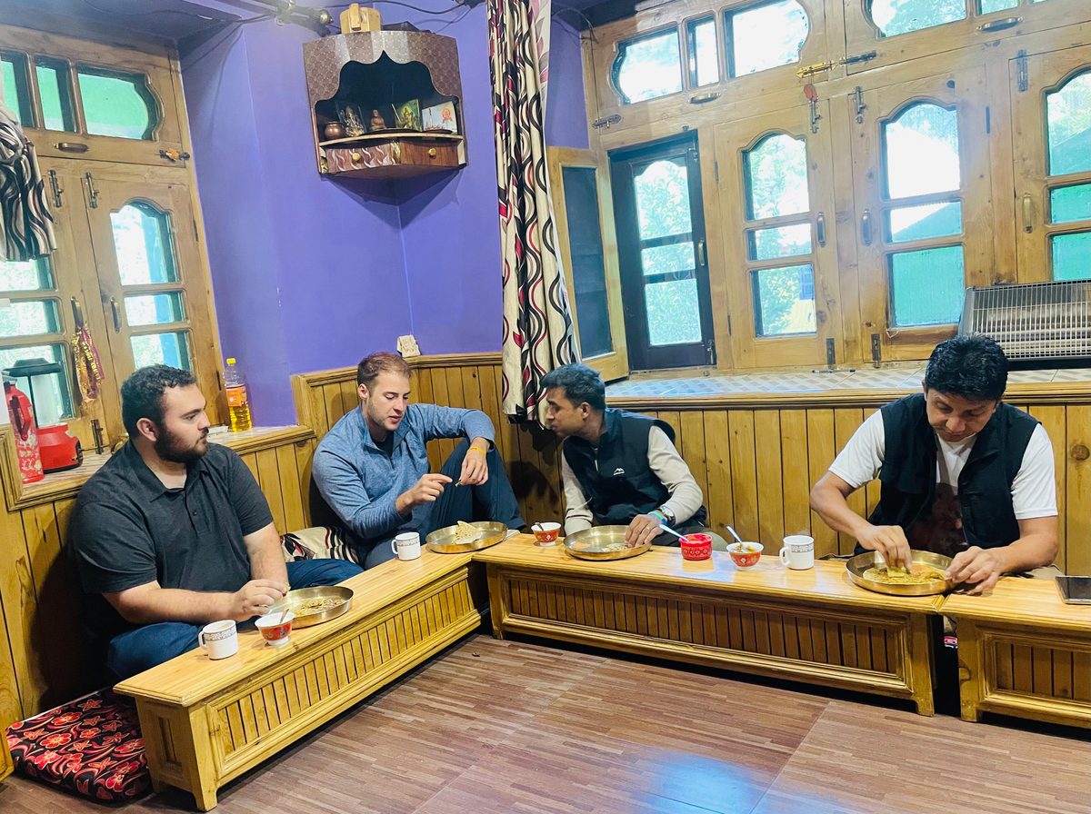 Guests sharing a meal at a Pangi Valley homestay